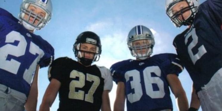 Woodason brothers where their football jerseys and helmets.