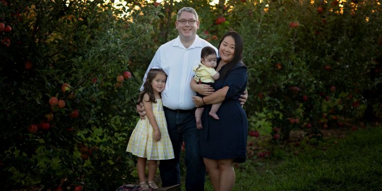 Charles Grimm poses with his wife Nancy, three-year-old daughter, Audrey and their four-month-old son.
