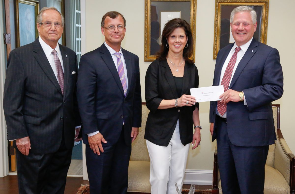 Alabama Power executives Mike Jordan and Leslie Sanders presents a grant for the College of Health Sciences to President Mike Williams and Vice Chancellor Wayne Baker.