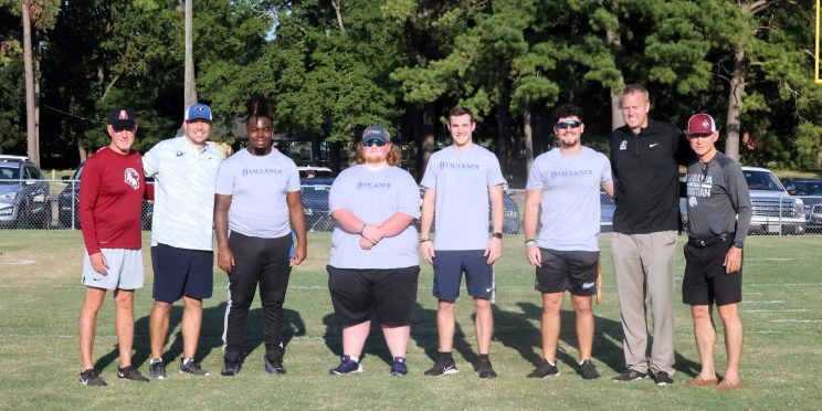 l-r ACA Athletic Advancement Officer Tim Perry, David Woodason, Faulkner students Ja'Veon Kynard, Bryce Hicks, Nicholas Butts, Santos Sanchez, ACA Athletic Director Aaron Greenwood and Director of Football Operations Don Gilliam.