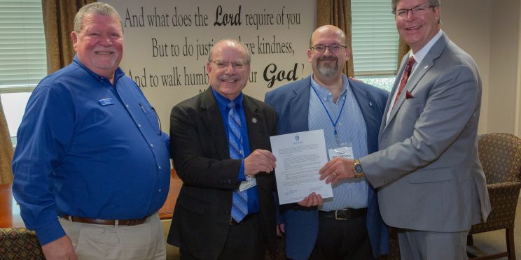 l-r Mike Horn, Denny Petrillo, Todd Brenneman, Mitch Henry sign agreement between Faulkner and Bear Valley.