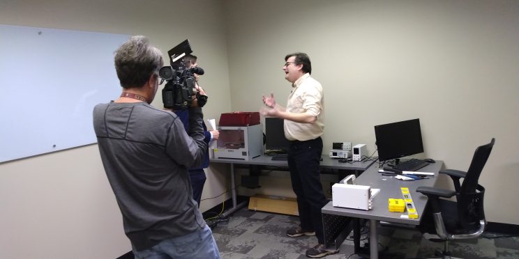 Mike Herridge, right, speaks with WSFA news crew about Faulkner's new Computer Engineering degree inside the new computer science department.