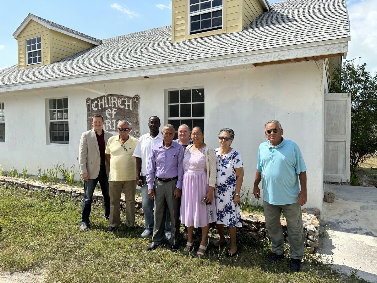 Church members pose outside Long Island Church of Christ after church services on Sunday.
