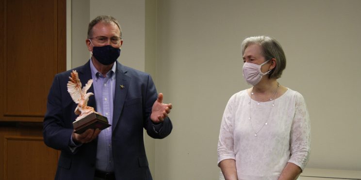 Alan Kaye stands with his wife Shirley during his retirement ceremony from the MSM program.