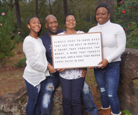 Tucker Family Holding Framed Quote in Woods