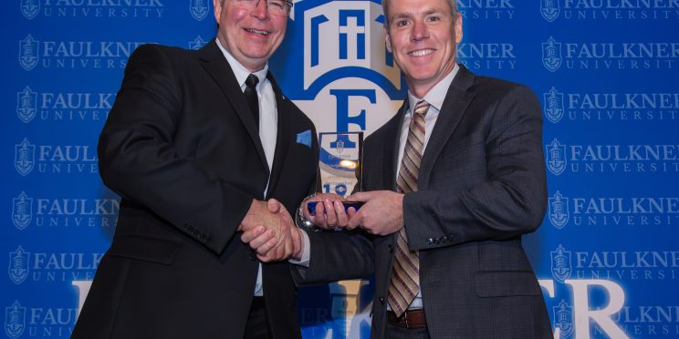 President Mitch Henry awards Jeremy Vest during the 2025 Marketplace Faith Friday Forums.