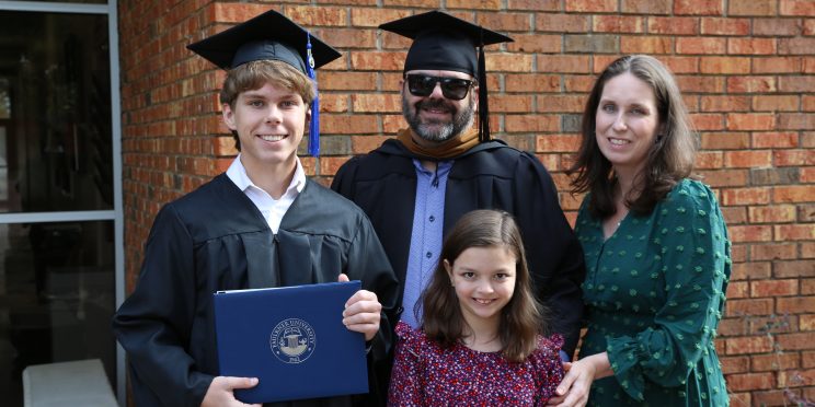 l-r Karson Oakley, left with his parents Kasey and Jessica and sister, Audrey after the graduation ceremony.