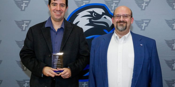 Caleb Cochran and Dr. Todd Brenneman. Cochran is awarded the Young Alumnus Award for the VP Black College of Biblical Studies.