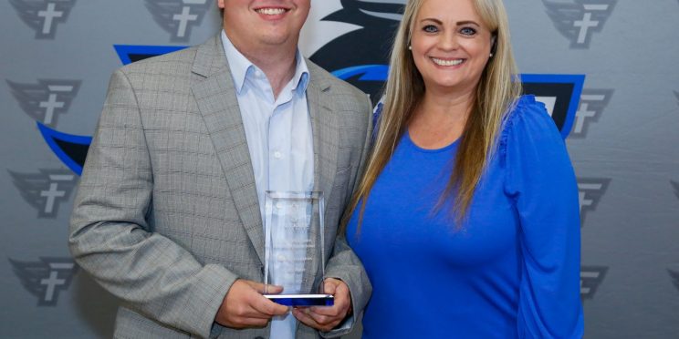l-r Cody Davis and Dr. Donna Clemons. Davis is presented with the Young Alumnus Award for the Marketplace Faith Friday Forums. He works as a coach for Montevallo High School.