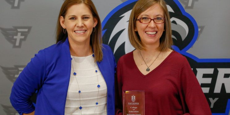 Taryn Brodie stands with Dr. Leslie Cowell, Dean of College of Education.