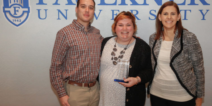 Center Kelsey Mills poses with her husband and Dr. Leslie Cowell.