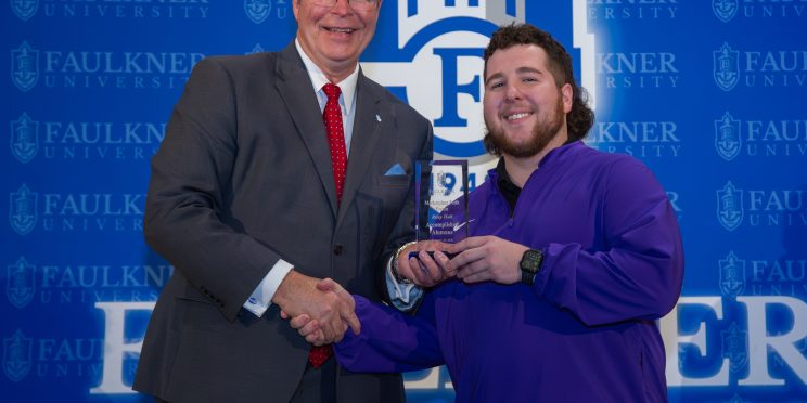 Riley Hall is given the Accomplished Alumnus Award during the 2026 Marketplace Faith Friday Forums.