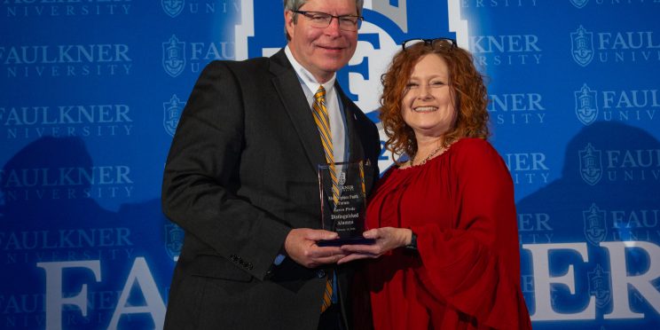 President Mitch Henry awards Karen Pirtle during the 2024 Marketplace Faith Friday Forums.