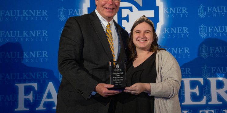 President Mitch Henry awards Margaret Berryman at the Marketplace Faith Friday Forums.