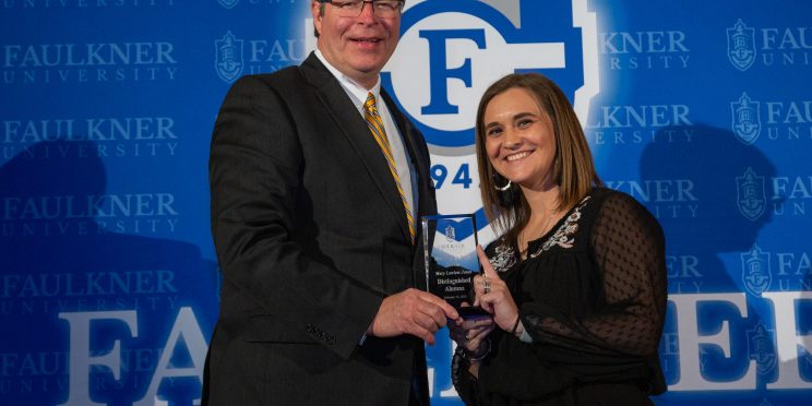 l-r President Mitch Henry presents Mary Lawless Jones with the Distinguished Alumna Award.