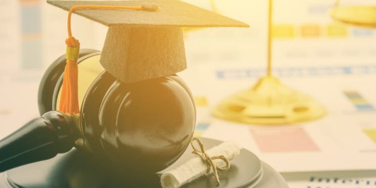 Mini Graduation cap on top of gavel