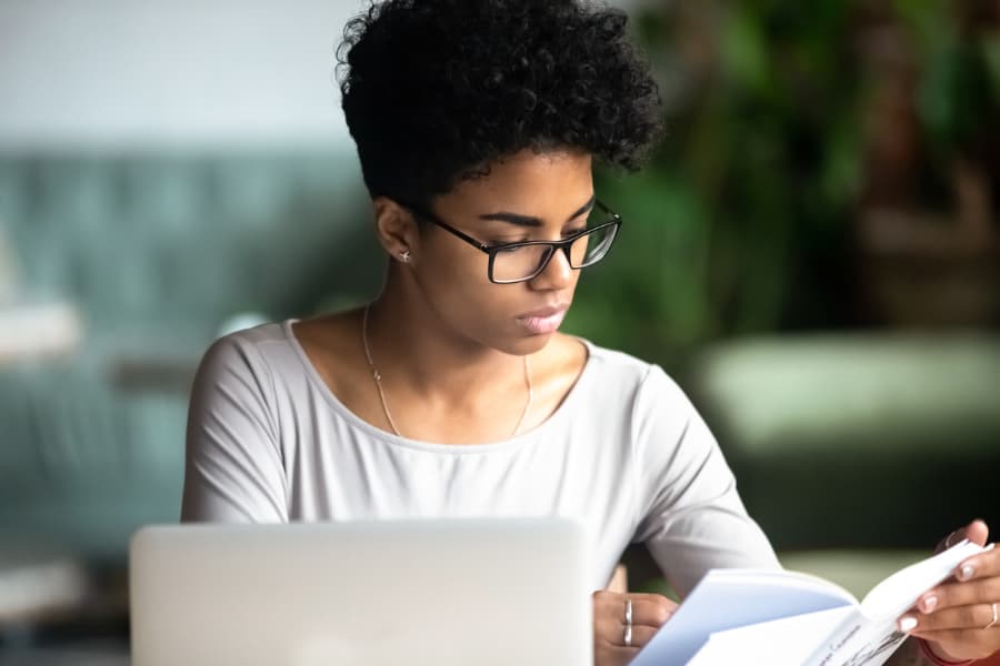 Business Student Taking Notes On Laptop