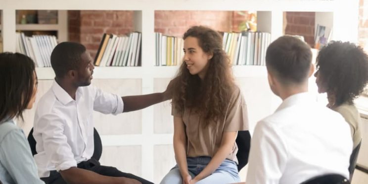 Leader showing compassion to therapy group