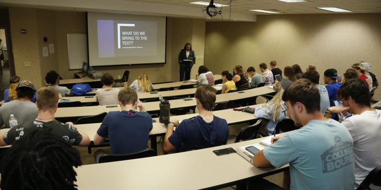 Students attend a lecture by Andrew Gifford on understanding Biblical literature.