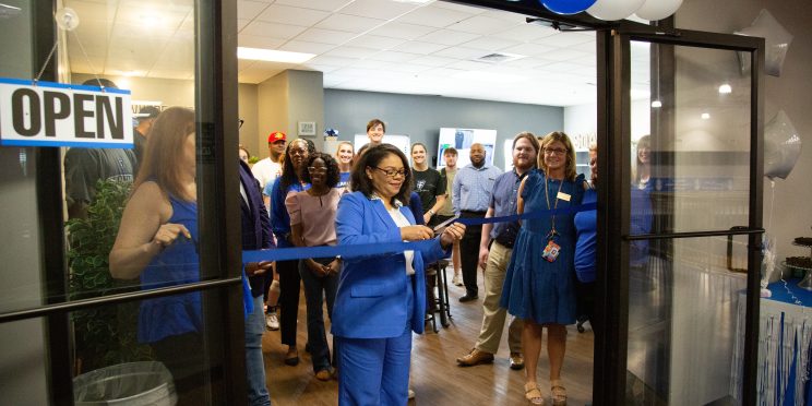 Dawn Chapman cuts the ribbon to open the new Soar Center.