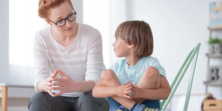 School Counselor Listening to Boy