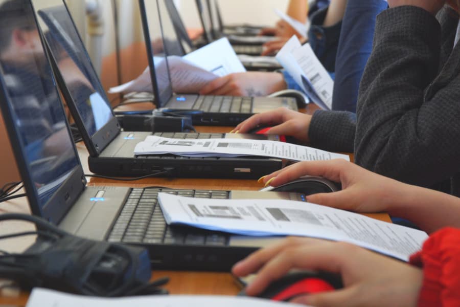 Students in front of laptop computers in class