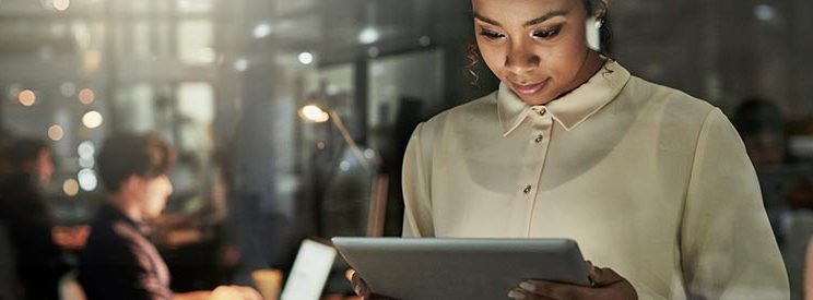 Cropped Image of College Student Looking at Tablet for Project