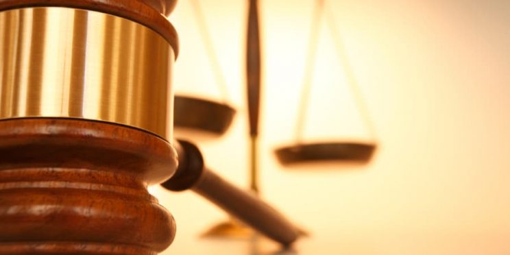Gavel With Scales In The Background