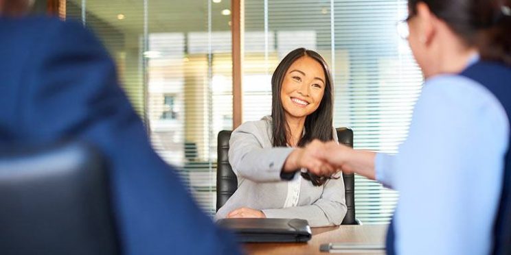 Woman Shaking Hands for Potential Internship