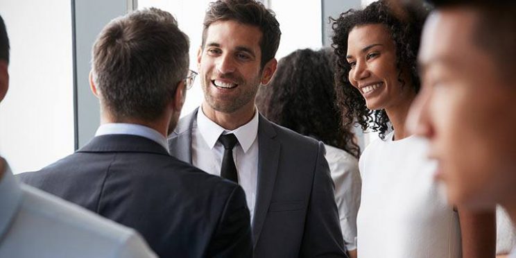 Young Man and Woman in Networking Event