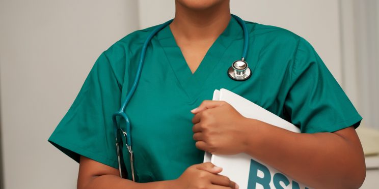 Nursing student holding bsn folder