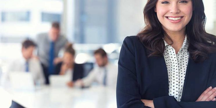 Human Resources Specialist in Front of Colleagues at Conference Table
