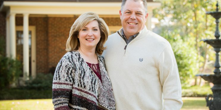 Scott McCown with wife Amy pose outside for a picture.