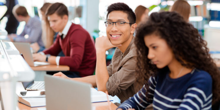 Students working on laptop computers during classes