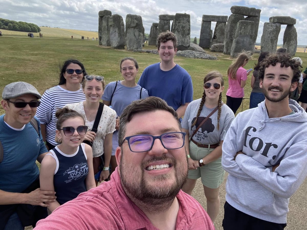 Peyton Jenkins takes a picture with the Great Books Study Abroad group in front of Stonehenge.
