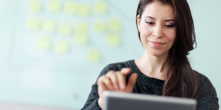 Woman Working on a Tablet